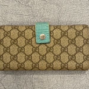Gucci wallet with teal accents